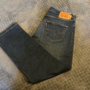 Gently used Levi 501 button fly distressed dark blue jeans